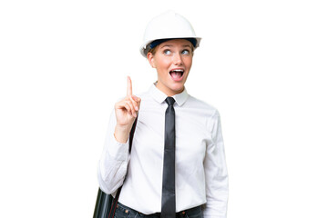 Young architect caucasian woman with helmet and holding blueprints over isolated background intending to realizes the solution while lifting a finger up