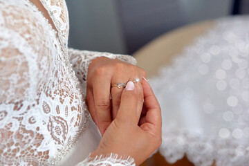 Shiny engagement ring on the bride's hand