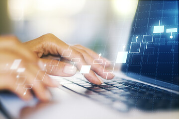 Multi exposure of abstract creative financial chart with hand typing on computer keyboard on background, research and analytics concept