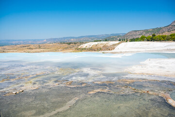 Calcite cliff of Pamukkale, white travertines in Turkey