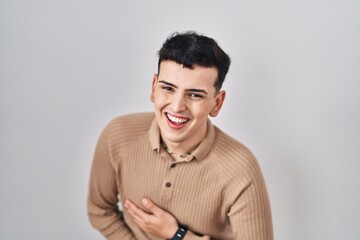 Obraz premium Non binary person standing over isolated background smiling and laughing hard out loud because funny crazy joke with hands on body.