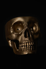 Gold human Skull Isolated on black background