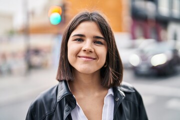 Young beautiful hispanic woman smiling confident standing at street