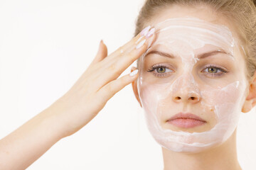Girl apply facial cream cosmetic