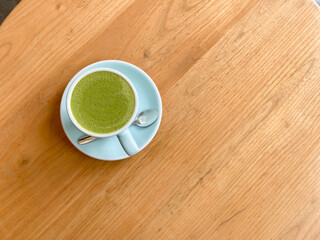 top view of japanese green tea matcha on wooden table, good for health and diet