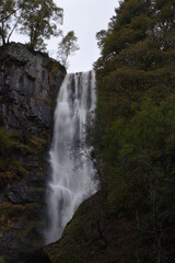 the tall Pistyll Rhaeadr waterfall in north wales from the bottom of it