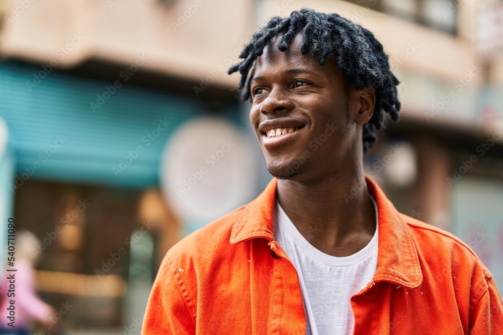 Sticker African american man smiling confident standing at street