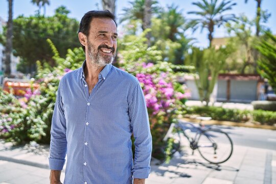 Middle Age Hispanic Man Smiling Happy Standing At The City.