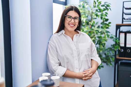 Young hispanic woman business worker smiling confident standing at office