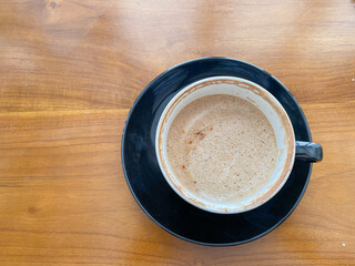 empty cup of coffee on wooden table in the cafe. black cup coffee before work and study