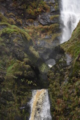 the tall Pistyll Rhaeadr waterfall in north wales from the bottom of it