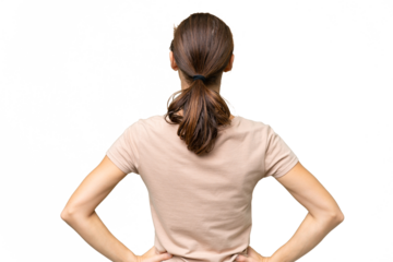 Young caucasian woman over isolated background in back position