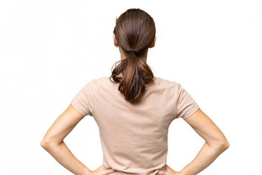 Young caucasian woman over isolated background in back position