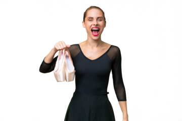 Young caucasian woman practicing ballet over isolated background with surprise facial expression