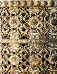 Antique carved metal background with floral patterns