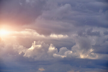 Fototapeta na wymiar Breaking sunlight through gap of storm clouds.