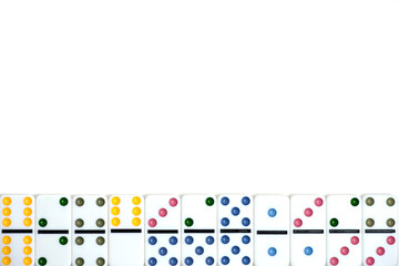 Multi colored domino knuckles white background.