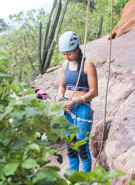 Rock climber tying into the rope