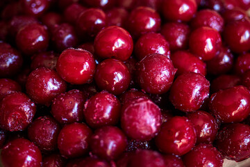 Frozen red cherry. Juicy ripe berry. View from top. Background full frame.