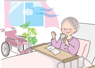 入院中にスマホの使い方を勉強する笑顔のおばあちゃん