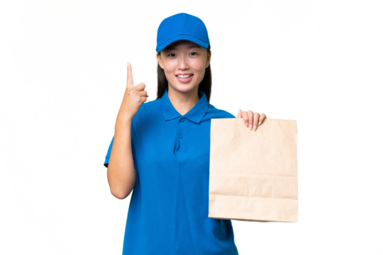 Young Asian woman taking a bag of takeaway food over isolated background pointing up a great idea