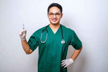 Pleasant smiling asian male doctor, physician in medical mask and gloves hold syringe with vaccine