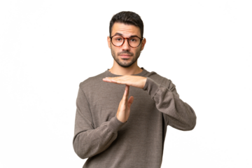 Young handsome caucasian man over isolated background making time out gesture