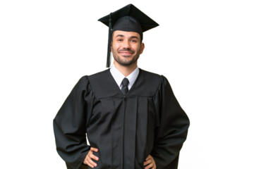 Young university graduate man over isolated background posing with arms at hip and smiling