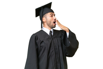 Young university graduate man over isolated background yawning and covering wide open mouth with...