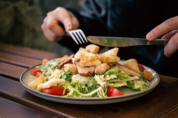 Salad with vegetables, bacon and chicken, close-up.