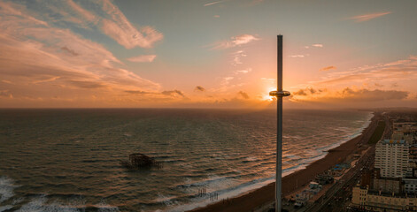 Beautiful Brighton beach view. Magical sunset and stormy weather in Brighton, UK. Town by the ocean in England.