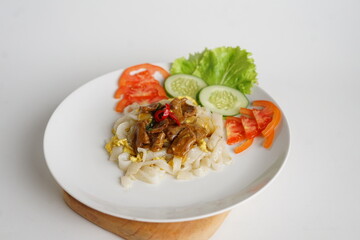 Kwetiau Siram Daging Sapi, Shiny Fresh Kwetiau as White Chinese noodles made from Rice. Popular in South East Asia 