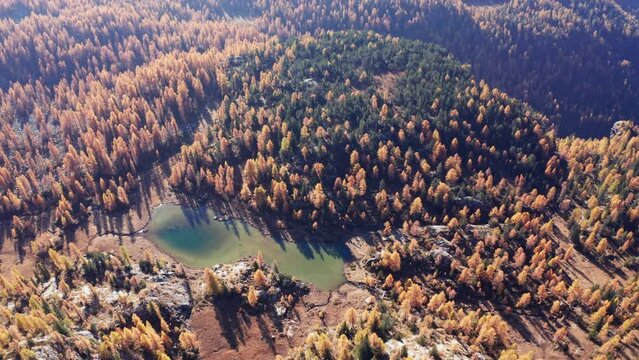Aerial 4K, Valmalenco in Italy, view of the area under Pizzo Scalino in autumn, Mufulè lake