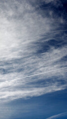Obraz premium blue sky with clouds as mobile wallpaper background, vertical phone wallpaper in blue and white 