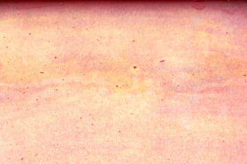 Grunge cracked red or pink color concrete wall textured background as loft style