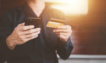 Mobile payment with wallet app via smartphone and credit card technology. Businessman shopping online shopping and paying. Futuristic Digital money transfer, e-commerce banking concept.