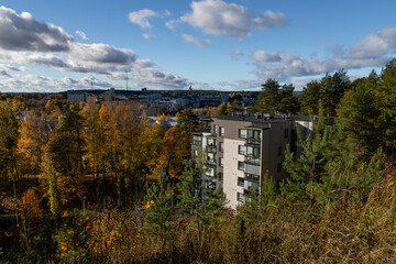 Lahti, Finland in autumn colors. Cityscape in the background and apartment building in the foreground