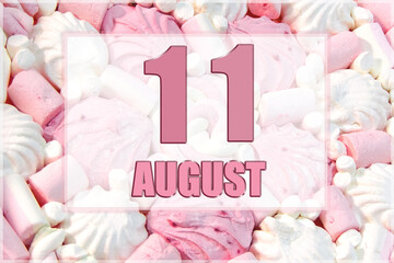 calendar date on the background of white and pink marshmallows. August 11 is the eleventh  day of the month