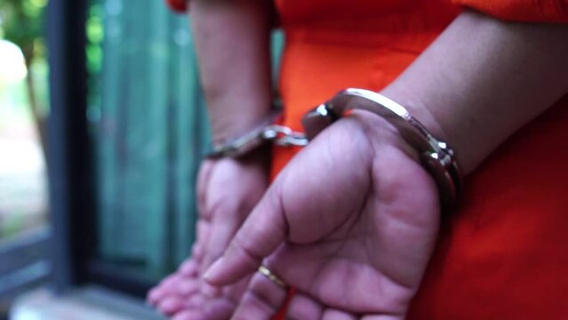The criminal is handcuffed and taken to the police station