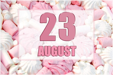 calendar date on the background of white and pink marshmallows. August 23 is the twenty-third day...