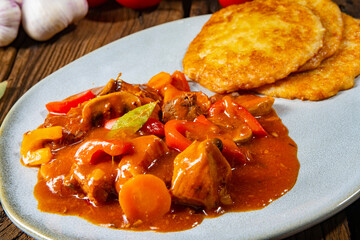 Hungarian goulash with potato pancakes