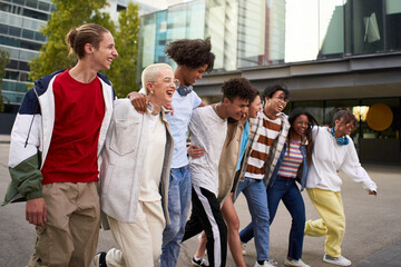 Group of multiracial group of friends having fun and hugging. Happy young people enjoying together...