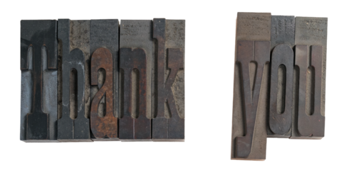 Isolated antique wood block type in reverse spelling thank you