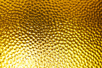 Shining golden textured mosaic glass background