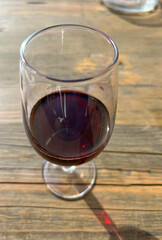 Red wine in a glass on a set table