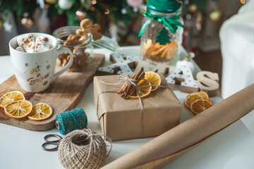 Eco gift wrapping for christmas. natural materials. Hot cup of cocoa with marshmallows. Winter...