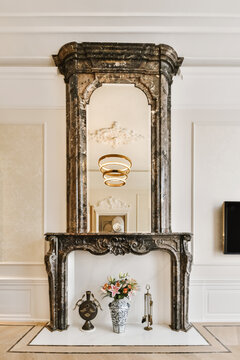 Ornament Fireplace Under Decorative Mirror