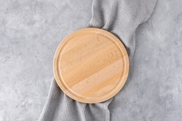 Cutting board with napkin on neutral grey background, top view, mockup