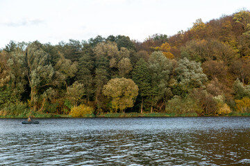 Natural background, wild nature, autumn forest by the lake.