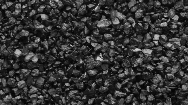 Black sand moving. Close-up of a black sand surface moving.